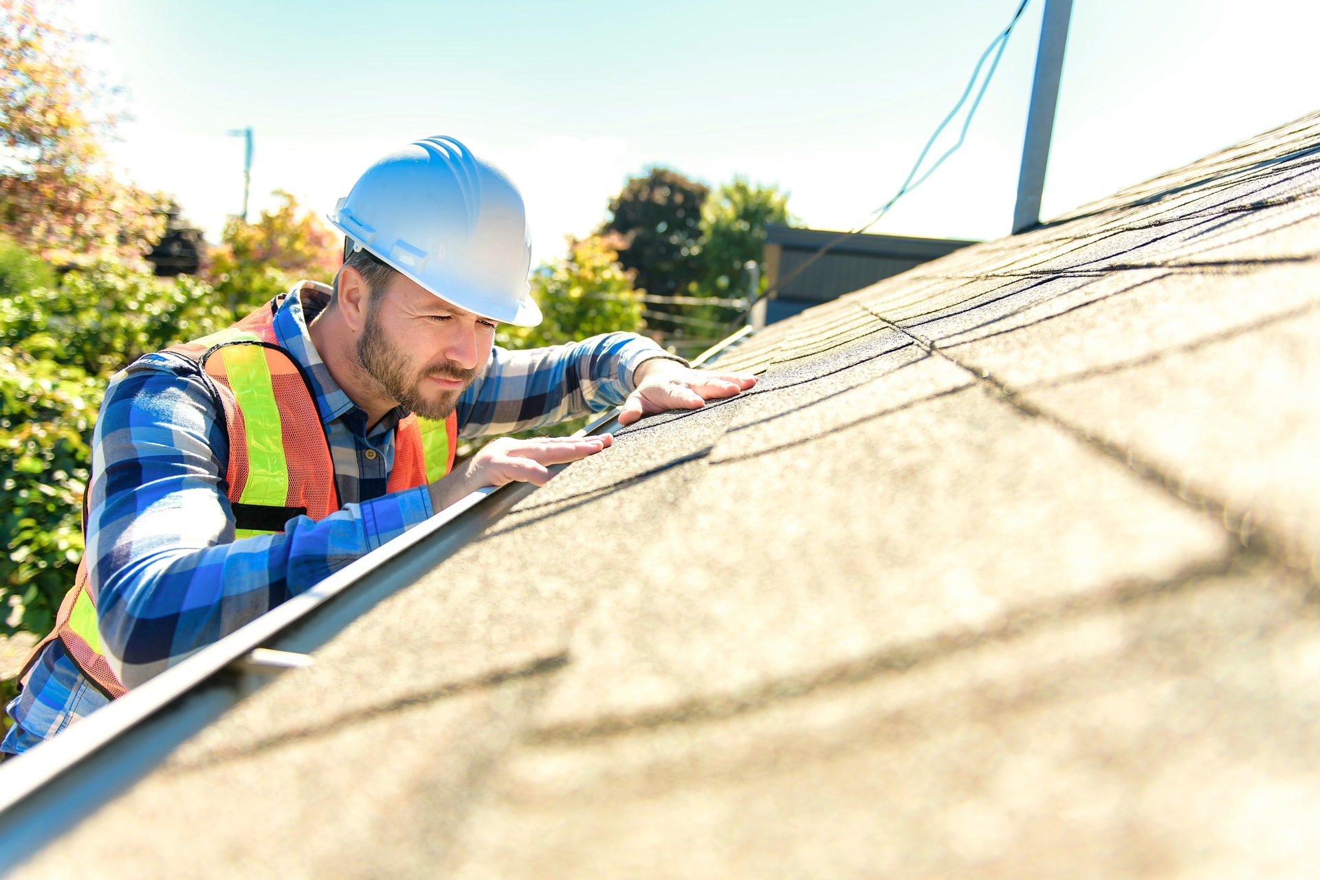 guy performing roof inspection